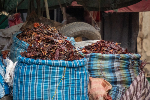 Quadro em tela Sacks of dried chilies at a stall in the Recycling Market in Asmara, Eritrea