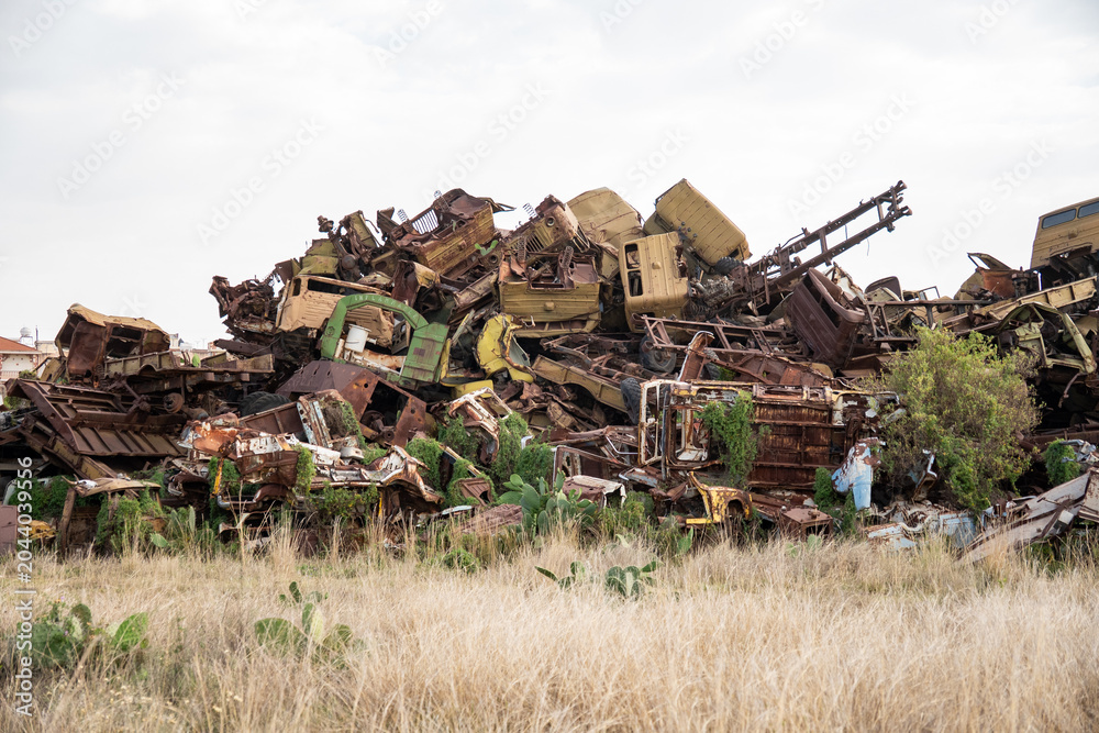 Fototapeta premium Pile of old trucks and military equipment at the tank graveyard on the outskirts of Asmara, Eritrea