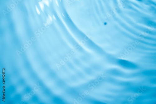 фотографія Gentle Water Ripples Reflecting Soft Blue Light in Calm Surface