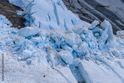 Fotografi Blue Glacier Ice Field And Jagged Rock Wall In British Columbia Coastal Mountain