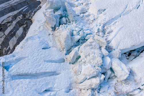 Cuadro en lienzo Aerial View Of Glacier Ice Crevasse And Broken Seracs On Rocky Glacier Edge In B