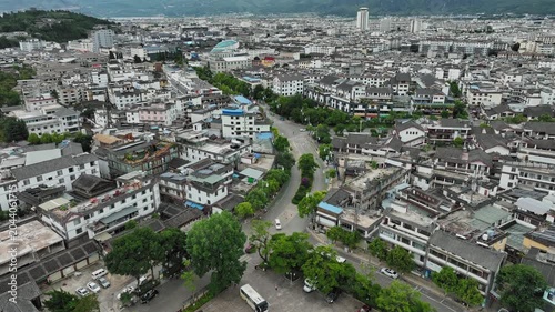 Aerial view of urban neighborhood by riverside park