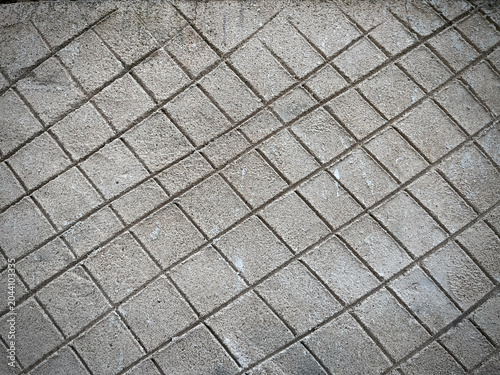 Geometric concrete pavement texture with diagonal tile pattern