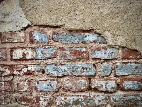 Quadro em tela Old brick wall texture with peeling plaster and weathered surface