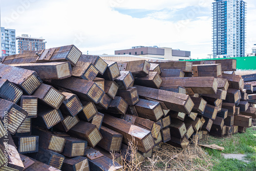 Used railway track ties sleepers beside a railway line