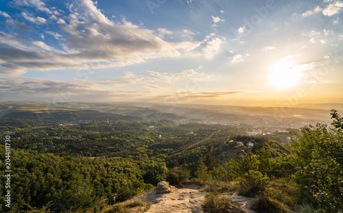View of the mountains and Kislovodsk from the observation decks of the Kislovodsk Park. Evening sunset over the mountains of Kislovodsk.