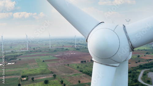 Εκτύπωση καμβά Wind Farm Horizon: Majestic wind turbines stretch across the horizon, their colossal blades catching the breeze under a vast sky, symbolizing renewable energy and a sustainable future