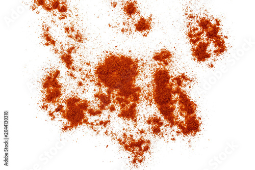 A detailed close-up of bright Orange Chili Powder granules dispersed randomly, showcasing texture and color against On Transparent Background