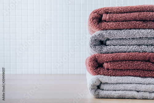Towels. Clean fresh fluffy towels on table in bathroom