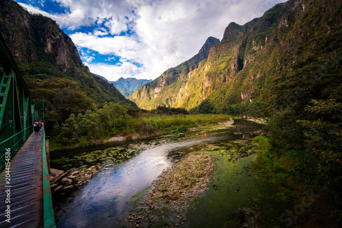 Scenic trekking trail along the railway towards Aguas Calientes village in Machu Picchu, Peru