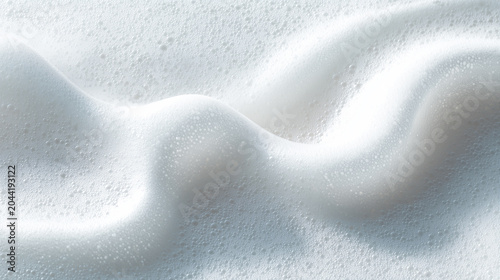 Smooth cosmetic mousse foam smear, airy and fluffy white texture with glossy highlights, soft and light appearance, isolated on clean white background, minimal skincare aesthetic