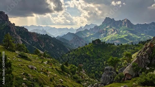 A beautiful landscape of mountains and valleys under a cloudy sky and sunlight
