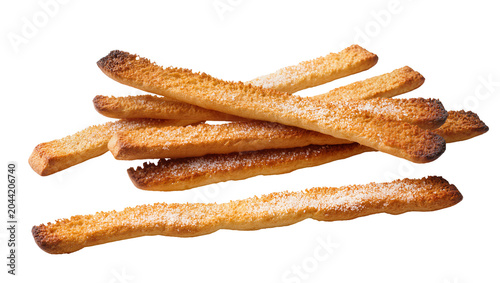 Картината върху платно Crispy golden baked breadsticks sprinkled with sugar