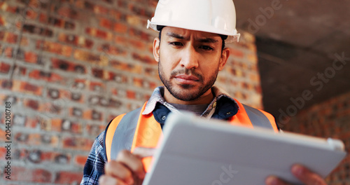 Construction  confused and man on tablet for building report  site inspection and mistake. Architecture  low angle and person on digital tech with error for renovation project  remodeling and concern