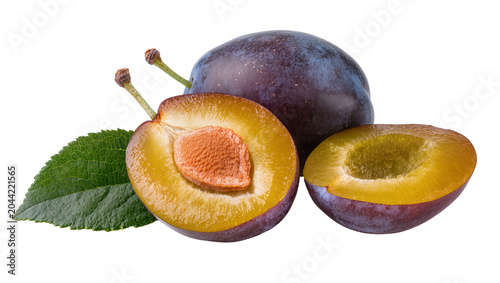 Принти на полотні Whole and halved ripe plums with green leaf