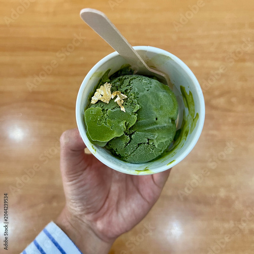 Premium Matcha Ice Cream with Gold Leaf in Hand