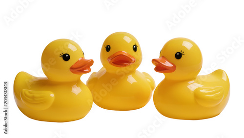 Fotografía Three yellow rubber ducks with orange beaks and black eyes