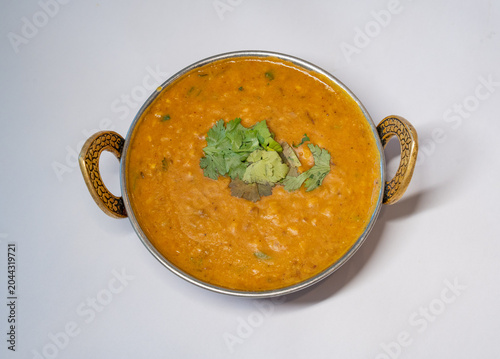 Dal Tadka Indian Food served in a traditional balti bowl garnished with fresh hara dhaniya