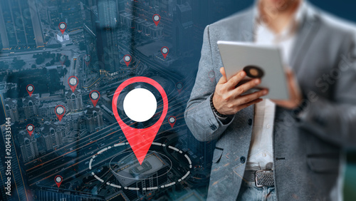 Slika na platnu Man using digital tablet to check taxi route on travel map in city area