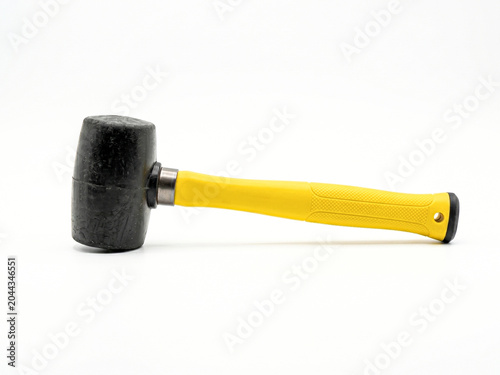 Photography Black rubber mallet with yellow fiberglass handle isolated on white background