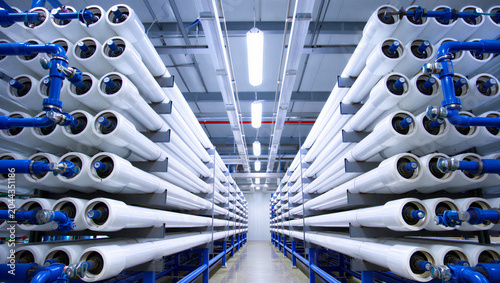 Bild auf Leinwand Interior view of a water treatment plant with rows of white cylindrical filtrati
