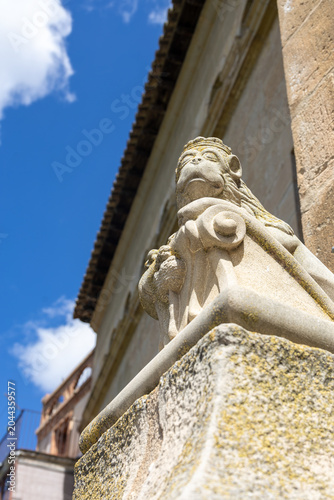 Medieval stone monster sculpture on a bridge pillar in Spain