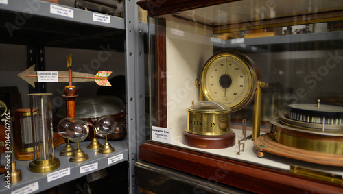 Obraz na płótnie Close up of antique scientific instruments including a brass barometer and a wea