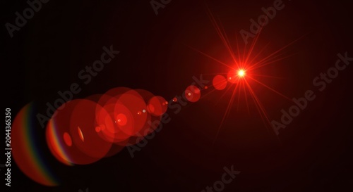 Bright red lens flare effect on dark background.