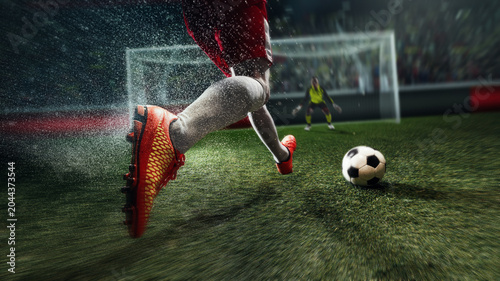 Cuadro en lienzo Soccer attacker running toward goal with red cleats and ball