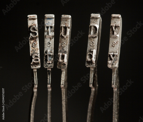 the word study with vintage typewriter hammers 