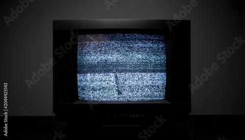 Obsolete television screen displaying white static noise