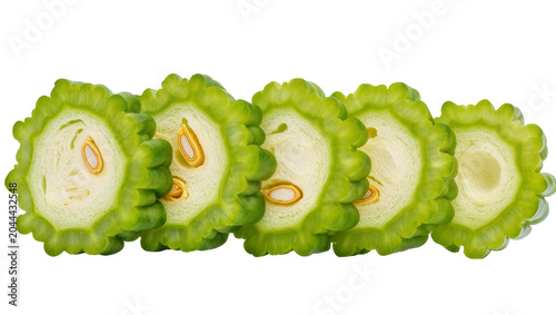 Fotografie Sliced bitter melon with visible seeds and white flesh