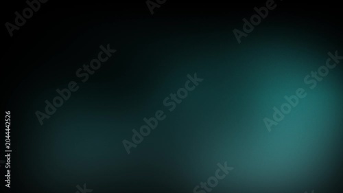 Animation abstract soft gradient light leaks loop motion background on black background. Abstract background with glowing teal spots.