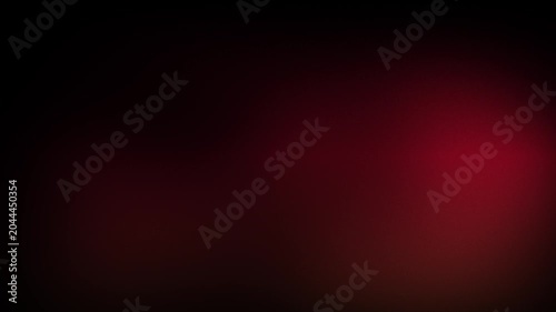 Animation abstract soft gradient light leaks loop motion background on black background. A dark background with a red light.