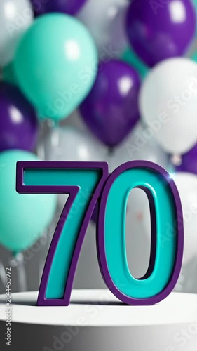 Colorful balloons in shades of teal, purple, and white surround a large decorative number 70 on a white pedestal, creating a festive atmosphere for a celebration