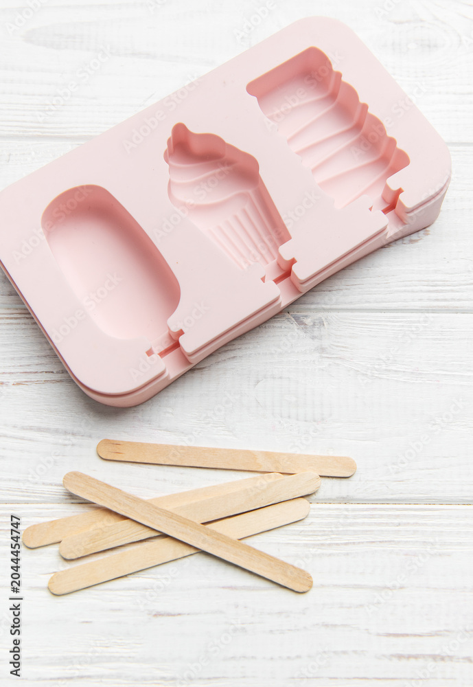 Obraz premium Pink silicone ice pop mold making summer treats