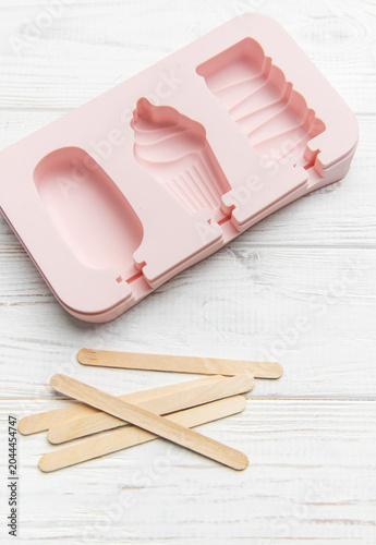 Pink silicone ice pop mold making summer treats