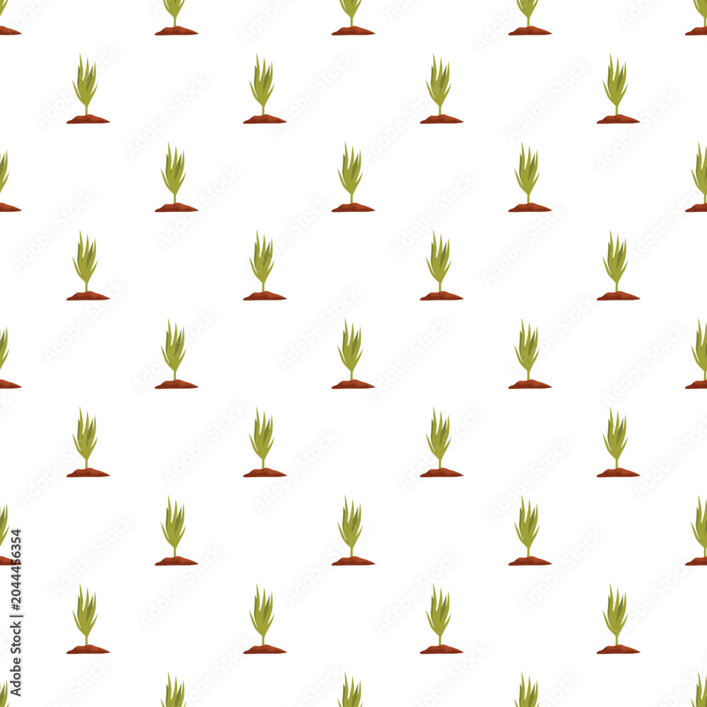 Obraz premium Small green sprouts growing from brown soil creating a repeating pattern