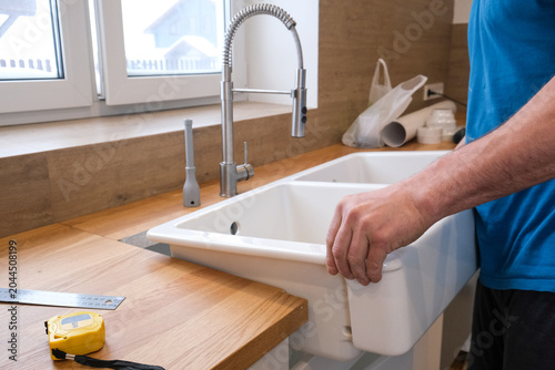 Photos Installing Sink And Faucets During Daylight Hours