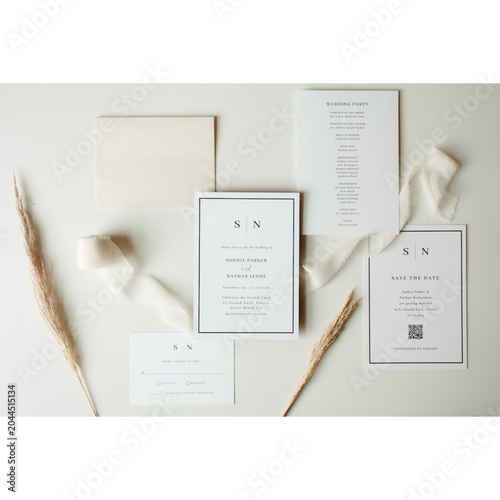 Wedding stationery suite with neutral ribbon and dried flowers