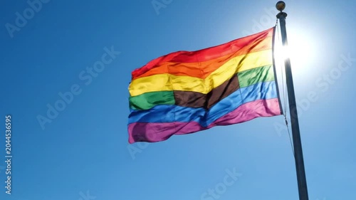 Colorful Flag Waving Proudly Against Bright Blue Sky