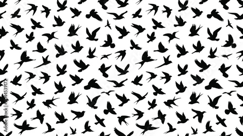 Photos Seamless pattern with silhouettes of flying birds