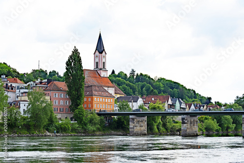 Looking across the River Inn and the Marienbrucke close to where it joins the River Danube in Passau, Germany.