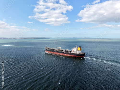 Aerial high angle view of an industrial oil tanker ship sailing in the open sea