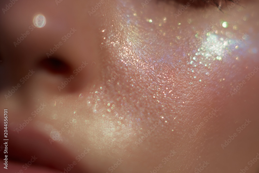 Fototapeta premium Macro closeup of opalescent shimmer on radiant skin for beauty background and skincare product banner