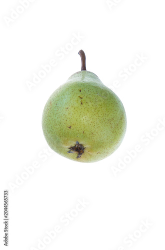 A green pear with brown irregular dots and spots, slightly from below, on white background