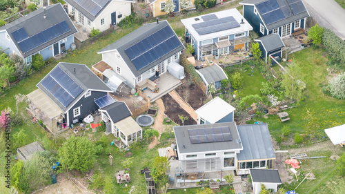Aerial drone view of an ecovillage in Almere, showing sustainable homes, community living, green space and ecological design.