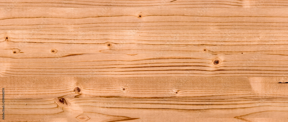 Fototapeta premium Wood texture background with natural grain patterns and knots on a light pine timber surface