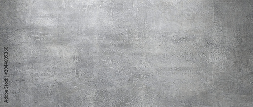 Foto Concrete texture background in smooth grey with subtle surface marks and aged mi
