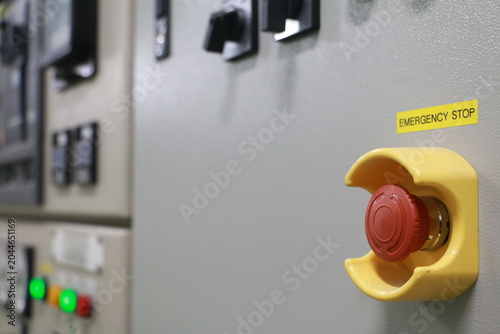 Push by man Emergency button on electric room used in the factory,Emergency stop machine.	

